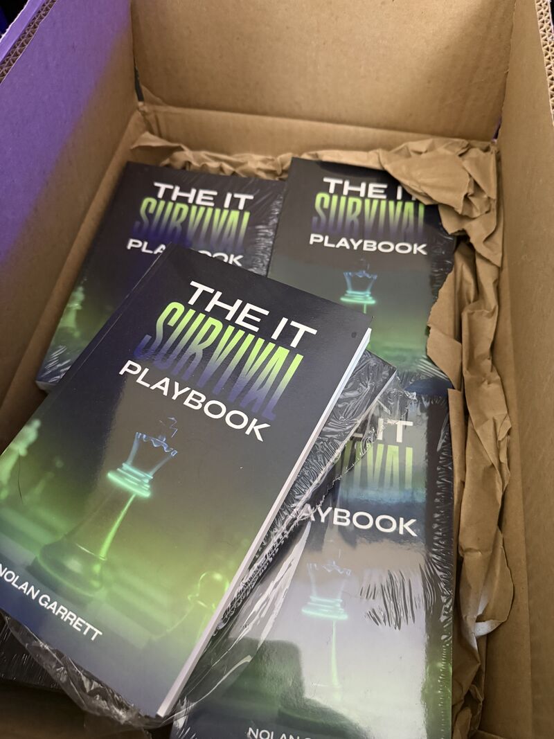 Physical copies of The IT Survival Playbook